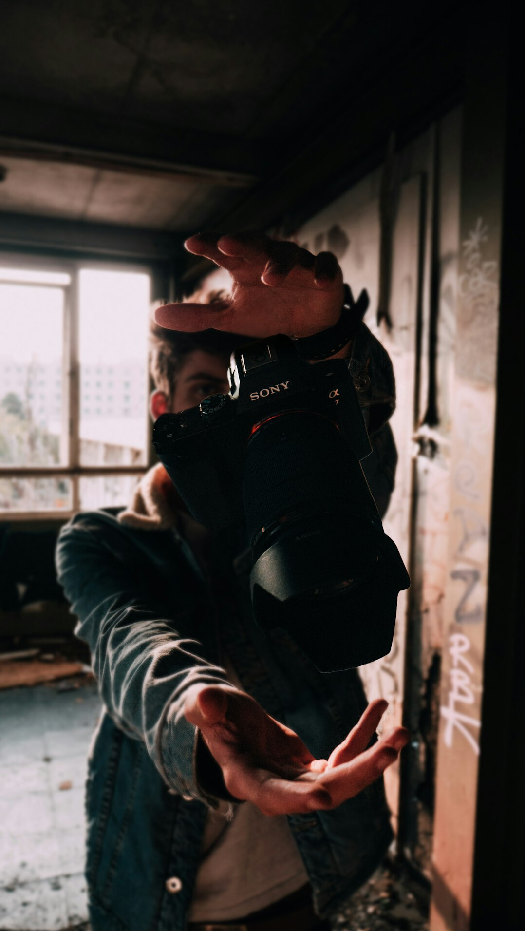 Portrait of a documentary photographer holding a film camera