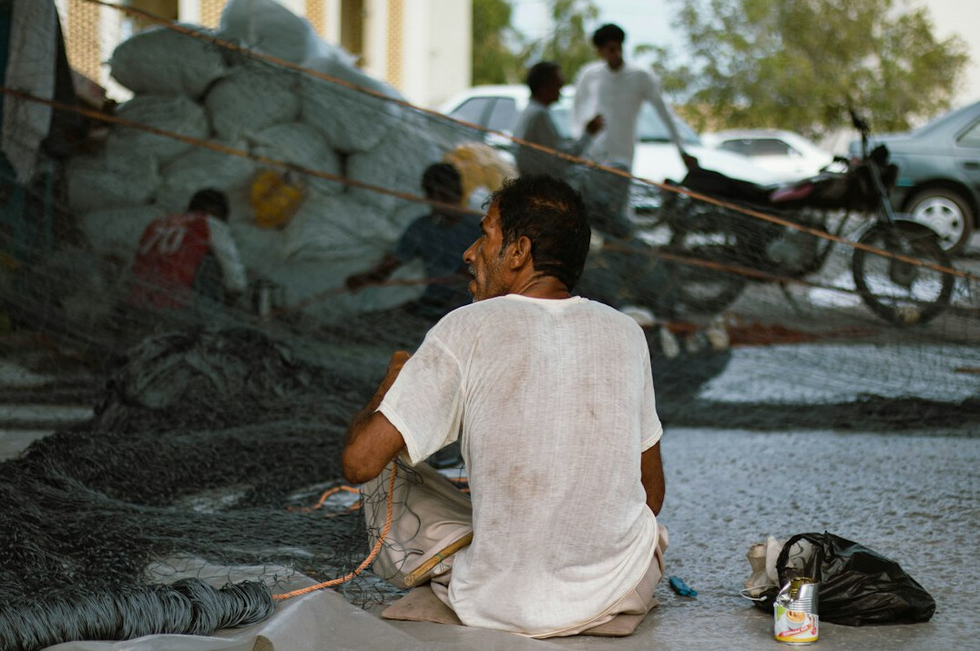 documentary photographer with local fisherman