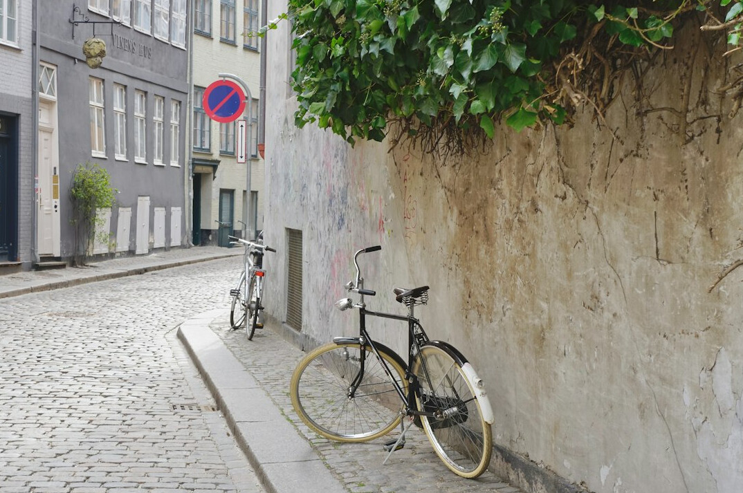 Narrow cobbled street with parked bicycles in Copenhagen
