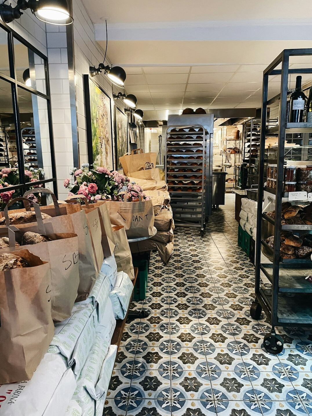 Shoppers browsing an outdoor food market hall in Copenhagen
