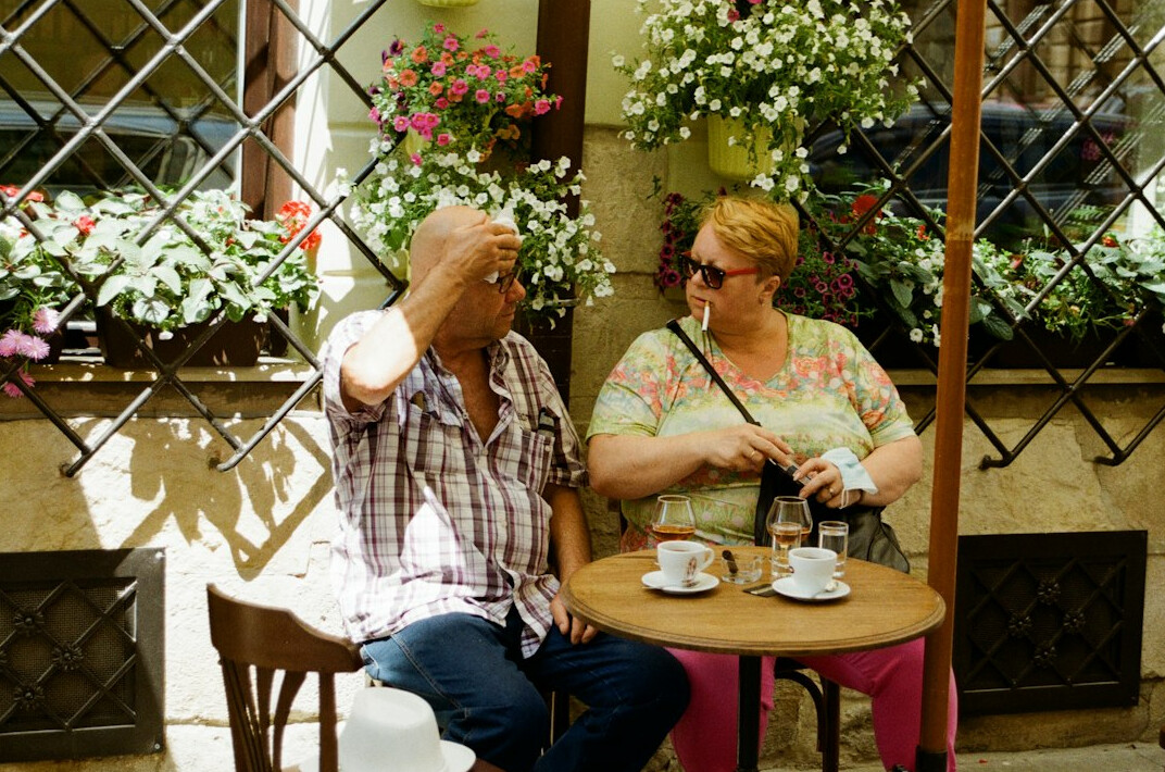 elderly man sharing story in cafe